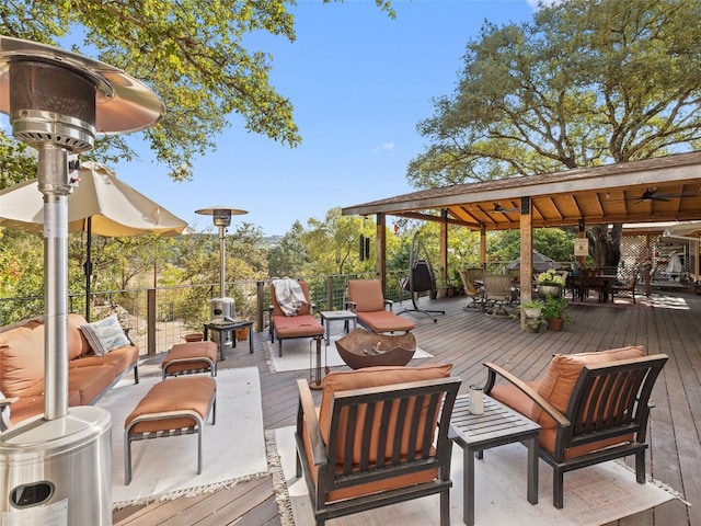 exterior space featuring ceiling fan and outdoor lounge area