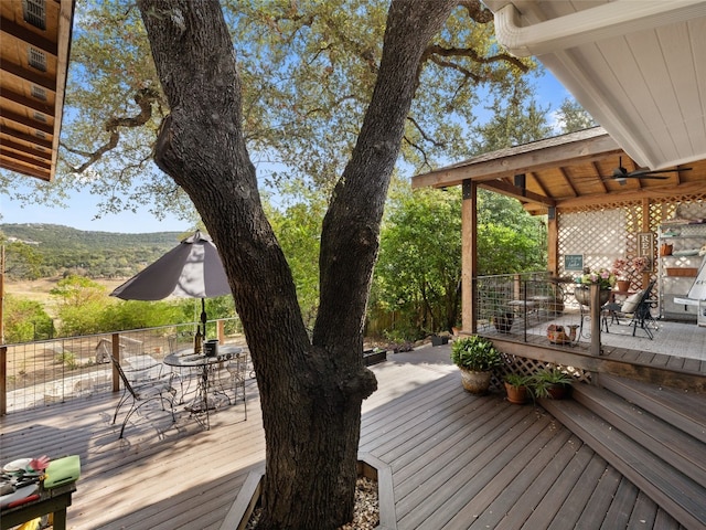 wooden terrace featuring ceiling fan