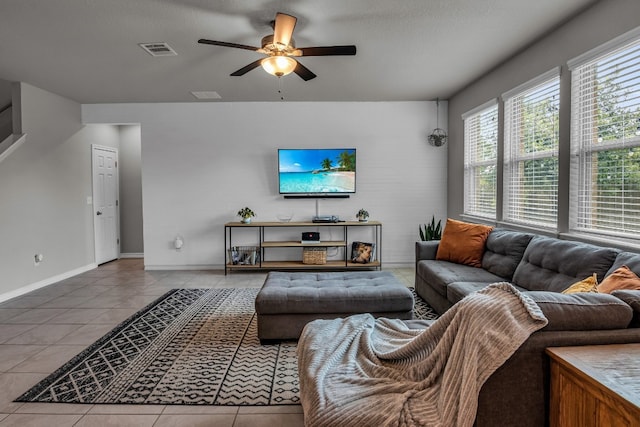 tiled living room featuring ceiling fan