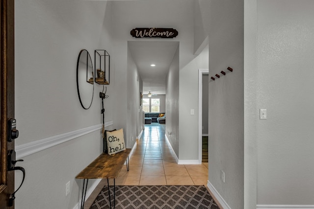 corridor with light tile patterned floors