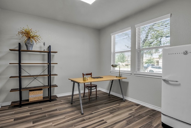 office with dark hardwood / wood-style flooring