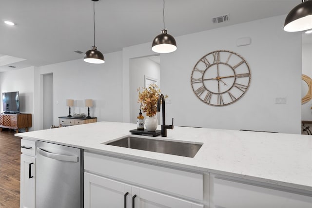 kitchen featuring white cabinets, light stone countertops, dishwasher, dark wood-type flooring, and sink