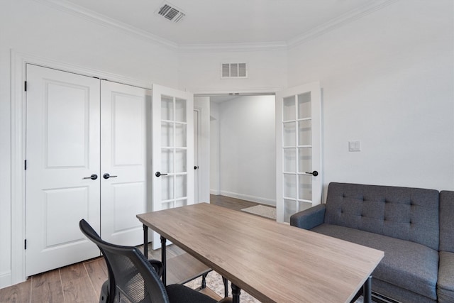 office space with french doors, crown molding, and dark hardwood / wood-style floors