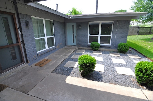 doorway to property with a patio area