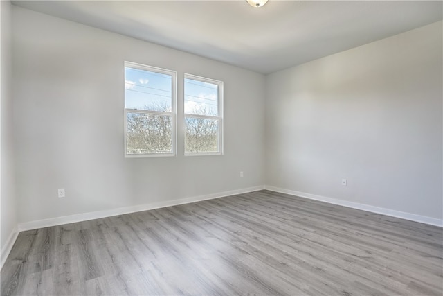 spare room featuring light hardwood / wood-style flooring