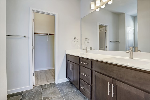 bathroom with vanity and hardwood / wood-style floors