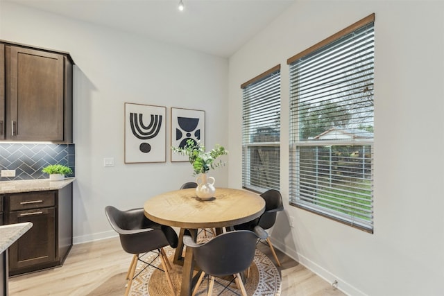 dining room with light wood-type flooring