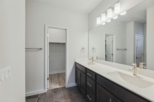 bathroom featuring tile patterned floors and vanity