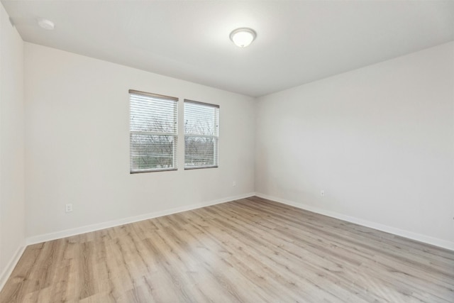 spare room featuring light wood-type flooring