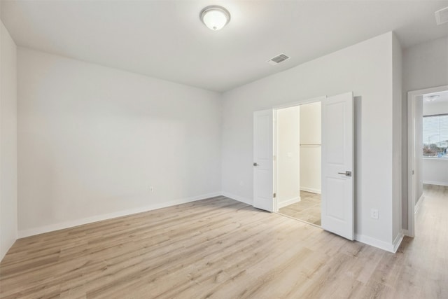 unfurnished bedroom featuring light wood-type flooring