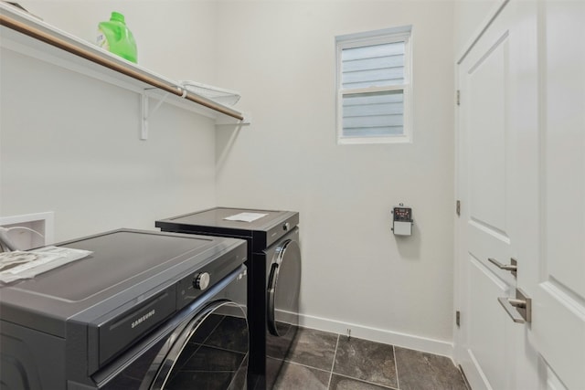 clothes washing area with separate washer and dryer