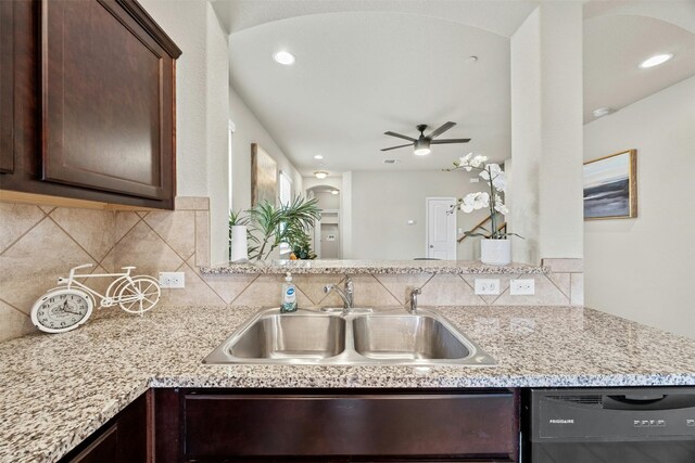 kitchen with light stone counters, ceiling fan, backsplash, dishwasher, and sink