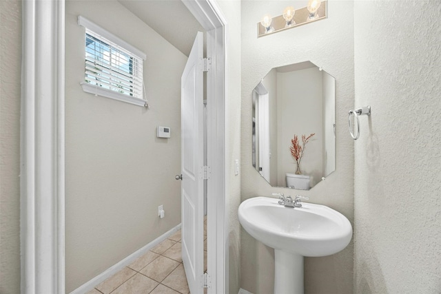 bathroom featuring tile patterned flooring and baseboards