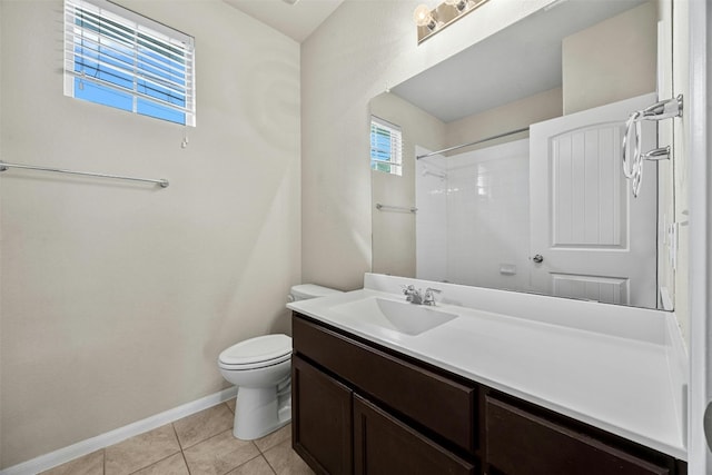 full bathroom with baseboards, toilet, tile patterned flooring, walk in shower, and vanity