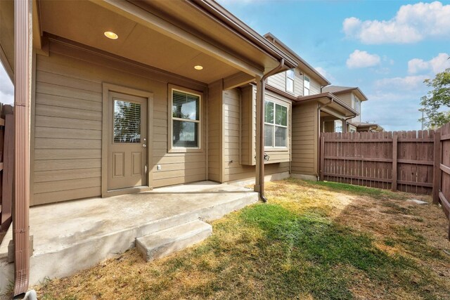 doorway to property with a patio area