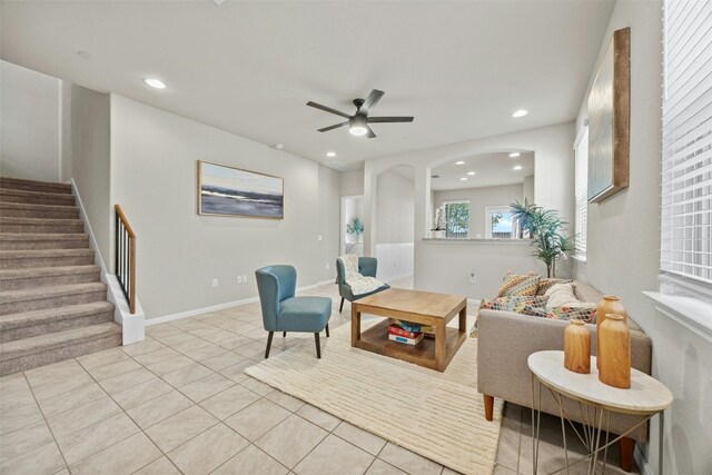 tiled living room featuring ceiling fan