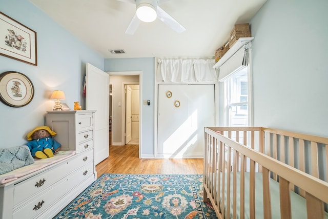 bedroom with ceiling fan and light hardwood / wood-style flooring