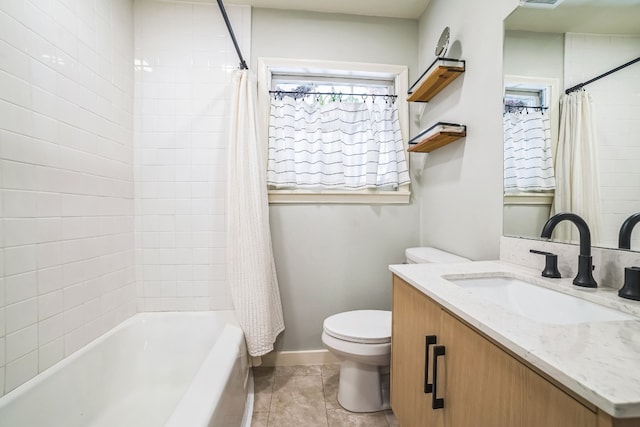 full bathroom featuring tile patterned floors, vanity, toilet, and shower / bath combo with shower curtain