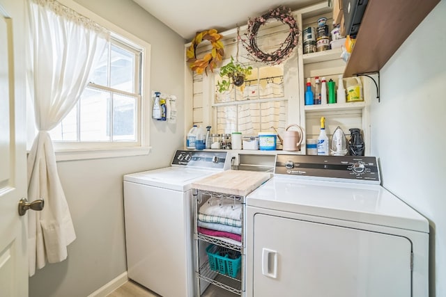 clothes washing area featuring washer and dryer