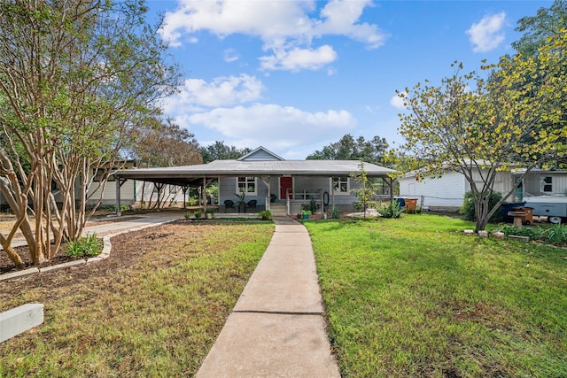 view of front of property featuring a carport, covered porch, and a front lawn