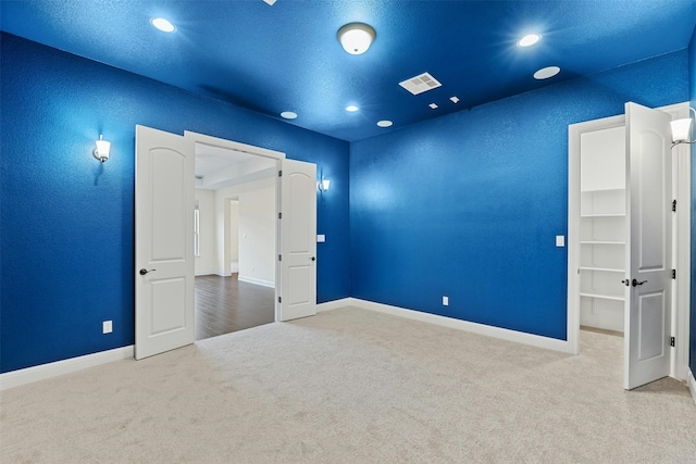 spare room featuring carpet flooring