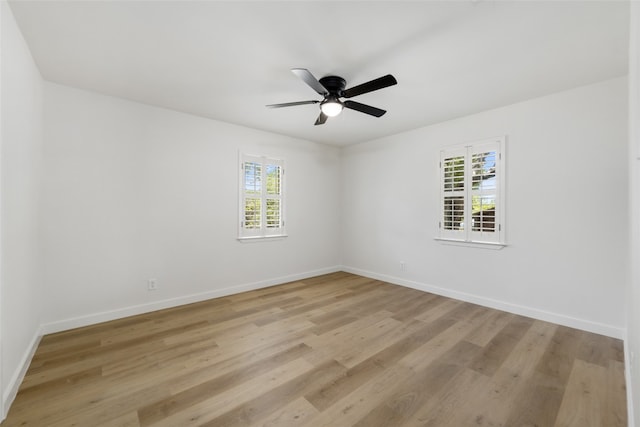 spare room with ceiling fan and light hardwood / wood-style flooring