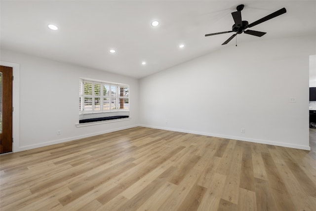 unfurnished living room featuring lofted ceiling, light hardwood / wood-style flooring, and ceiling fan