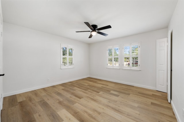 unfurnished room with light wood-type flooring and ceiling fan