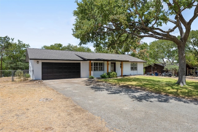 ranch-style home with a garage