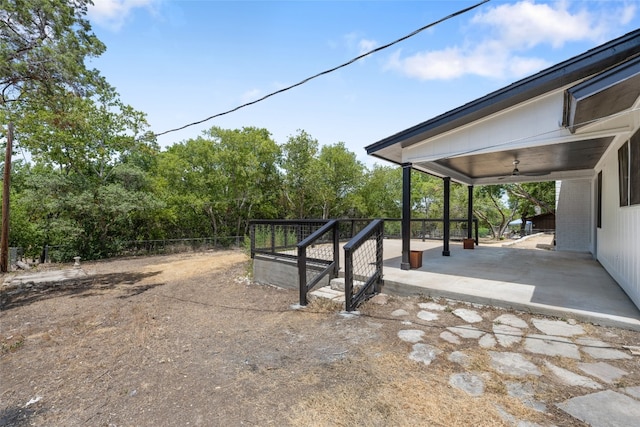 view of yard with a patio area and ceiling fan