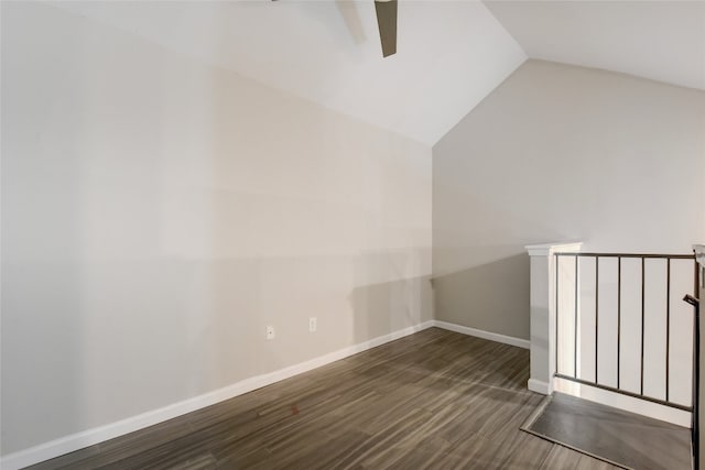 bonus room with lofted ceiling and dark hardwood / wood-style floors