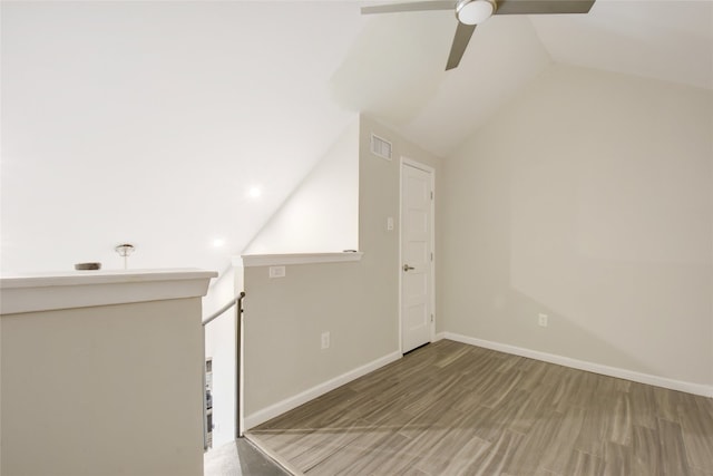 bonus room featuring ceiling fan, hardwood / wood-style flooring, and vaulted ceiling