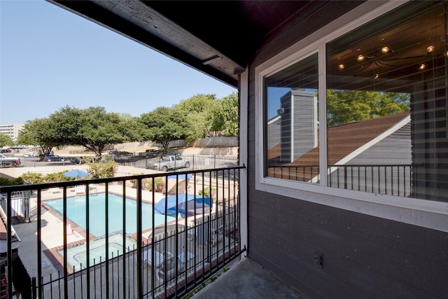 balcony featuring a hot tub and a patio