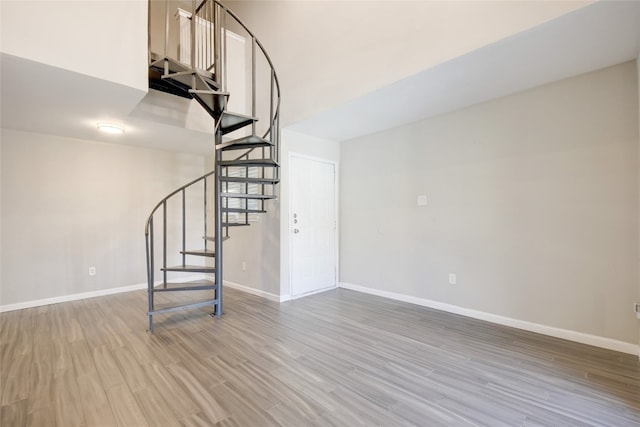 staircase with wood-type flooring