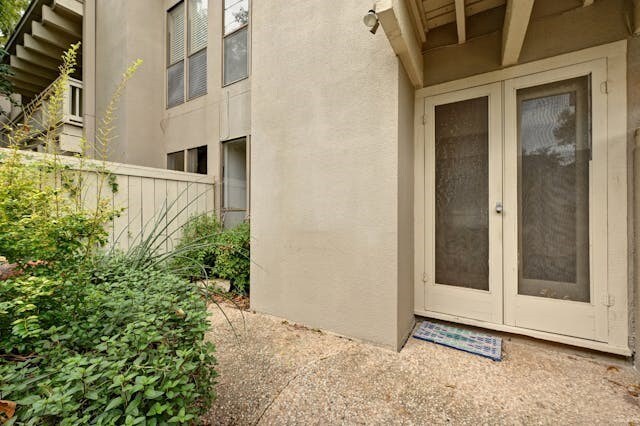 view of exterior entry featuring french doors