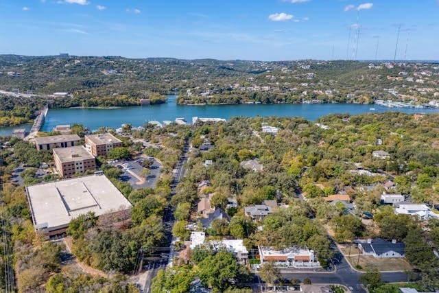 birds eye view of property featuring a water view