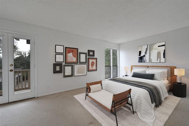 bedroom with baseboards, access to outside, french doors, and light colored carpet