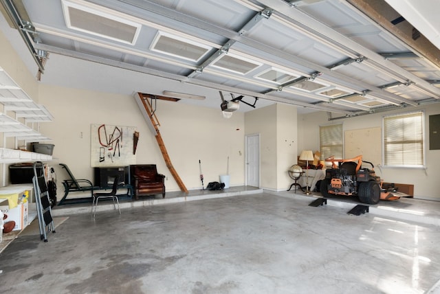 garage featuring a garage door opener and electric panel