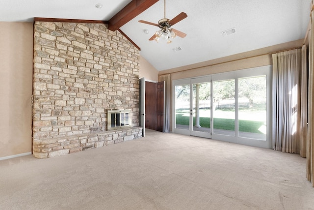 unfurnished living room featuring light carpet, beam ceiling, a fireplace, and ceiling fan