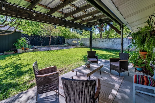 view of patio / terrace featuring ceiling fan