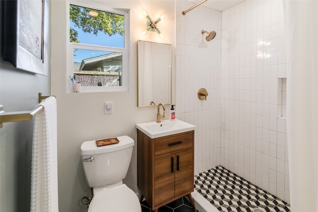 bathroom with vanity, a shower with shower curtain, and toilet