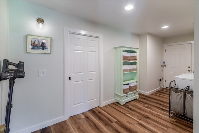 interior space featuring washer / dryer and hardwood / wood-style flooring