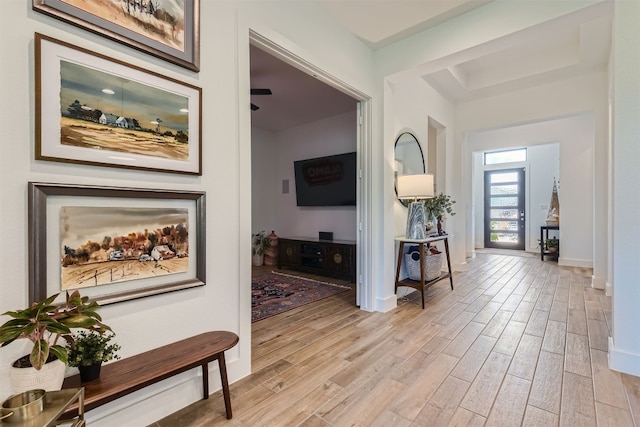 corridor with light hardwood / wood-style flooring