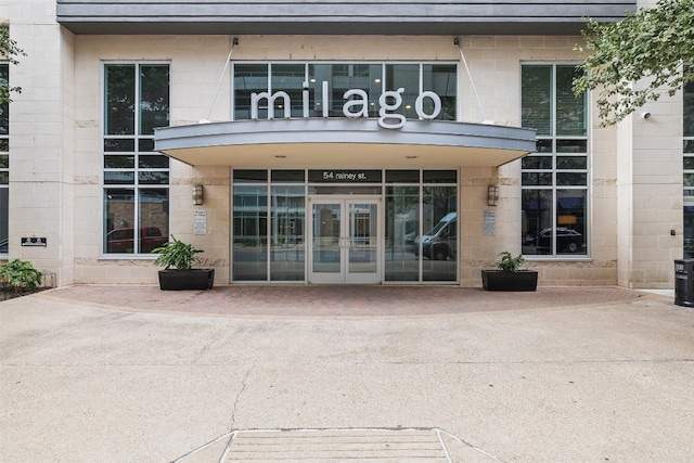 view of exterior entry featuring french doors