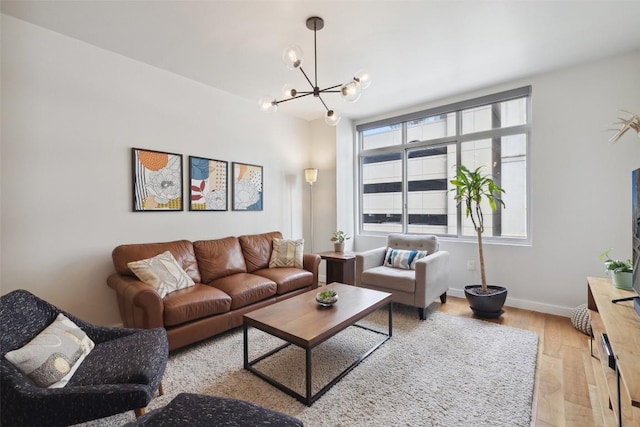 54 Rainey St Unit 503, Austin, TX 78701 - living area with baseboards, light wood finished floors, and a notable chandelier