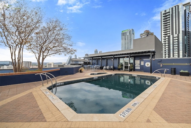 view of swimming pool with a patio area