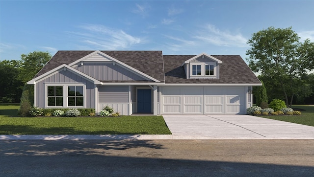 view of front of house with a front yard and a garage