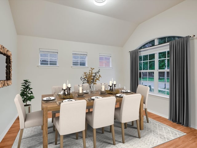 dining space with lofted ceiling and hardwood / wood-style floors