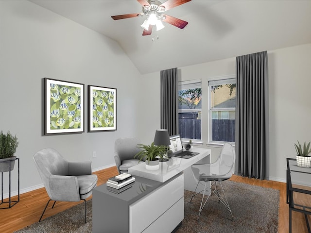 office area with ceiling fan, wood-type flooring, and vaulted ceiling