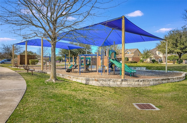 view of jungle gym with a lawn